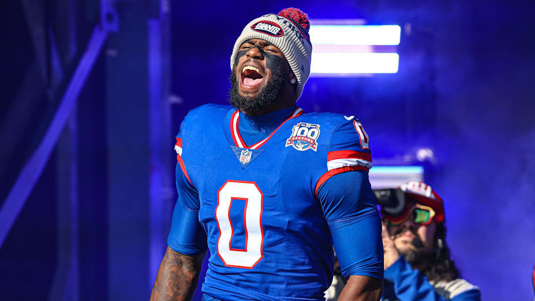 Nov 3, 2024; East Rutherford, New Jersey, USA;  New York Giants linebacker Brian Burns (0) reacts during introductions before the game against the Washington Commanders at MetLife Stadium. Mandatory Credit: Vincent Carchietta-Imagn Images