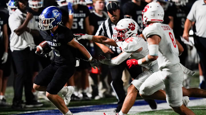 Beechwood Tigers defensive back Nathan Pabst pushes Covington Catholic Colonels quarterback Dylan Gainer out-of-bounds in the third quarter of a high school football game between the Covington Catholic Colonels and Beechwood Tigers, Friday, Sept. 20, 2024, at Dennis Griffin Stadium in Park Hills, Ky. Colonels won 49-28. Beechwood Tigers defensive back Nathan Pabst pushes Covington Catholic Colonels quarterback Dylan Gainer out-of-bounds in the third quarter of a high school football game between the Covington Catholic Colonels and Beechwood Tigers, Friday, Sept. 20, 2024, at Dennis Griffin Stadium in Park Hills, Ky. Colonels won 49-28.
