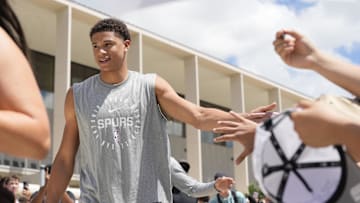 Jun 28, 2025; San Antonio, TX, USA; San Antonio Spurs first round draft pick Carter Bryant greets fans at Victory Capital Performance Center. Mandatory Credit: Scott Wachter-Imagn Images