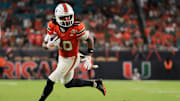 Nov 15, 2025; Miami Gardens, Florida, USA; Miami Hurricanes wide receiver Malachi Toney (10) carries the football for a touchdown against NC State Wolfpack during the fourth quarter at Hard Rock Stadium. Mandatory Credit: Sam Navarro-Imagn Images