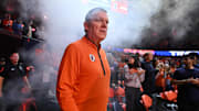 Nov 11, 2025; Champaign, Illinois, USA; Illinois Fighting Illini head coach Brad Underwood walks to the court before the game against the Texas Tech Red Raiders at State Farm Center. Mandatory Credit: Ron Johnson-Imagn Images
