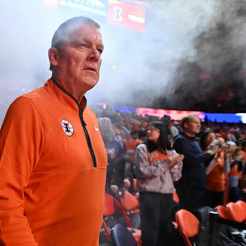 Nov 11, 2025; Champaign, Illinois, USA; Illinois Fighting Illini head coach Brad Underwood walks to the court before the game against the Texas Tech Red Raiders at State Farm Center. Mandatory Credit: Ron Johnson-Imagn Images