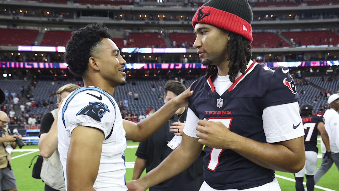Aug 16, 2025; Houston, Texas, USA; Carolina Panthers quarterback Bryce Young (9) and Houston Texans quarterback C.J. Stroud (7) greet on the field after the game at NRG Stadium. Mandatory Credit: Troy Taormina-Imagn Images