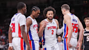 Nov 18, 2025; Atlanta, Georgia, USA; Detroit Pistons guard Javonte Green (31) and guard Ausar Thompson (9) and guard Cade Cunningham (2) and forward Duncan Robinson (55) against the Atlanta Hawks in the fourth quarter at State Farm Arena. Mandatory Credit: Brett Davis-Imagn Images