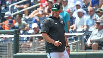 Jun 13, 2025; Omaha, Neb, USA; Coastal Carolina Chanticleers head coach Kevin Schnall looks to the field during the game against the Arizona Wildcats during the fifth inning at Charles Schwab Field.