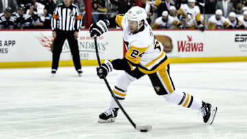 Apr 11, 2025; Newark, New Jersey, USA; Pittsburgh Penguins defenseman Matt Grzelcyk (24) shoots the puck during the first period against the New Jersey Devils at Prudential Center. Mandatory Credit: John Jones-Imagn Images