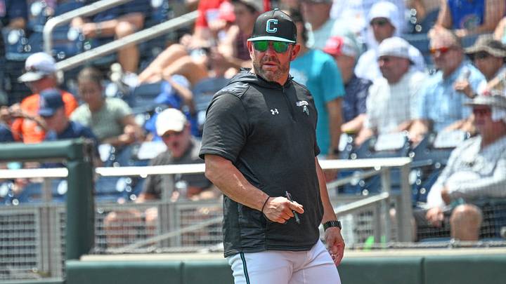 Jun 13, 2025; Omaha, Neb, USA; Coastal Carolina Chanticleers head coach Kevin Schnall looks to the field during the game against the Arizona Wildcats during the fifth inning at Charles Schwab Field. Mandatory Credit: Steven Branscombe-Imagn Images