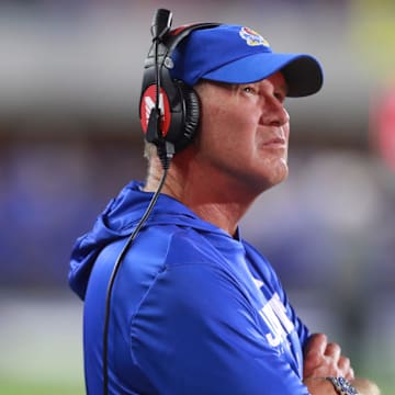 Kansas Jayhawks head coach Lance Leipold watches the scoreboard during the game between Fresno State and Kansas at David Booth Kansas Memorial Stadium on Aug. 23, 2025.