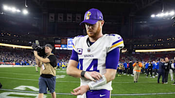 Jan 13, 2025; Glendale, AZ, USA; Minnesota Vikings quarterback Sam Darnold (14) reacts as he walks off the field after losing to the Los Angeles Rams during an NFC wild card game at State Farm Stadium. Mandatory Credit: Mark J. Rebilas-Imagn Images