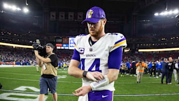 Jan 13, 2025; Glendale, AZ, USA; Minnesota Vikings quarterback Sam Darnold (14) reacts as he walks off the field after losing to the Los Angeles Rams during an NFC wild card game at State Farm Stadium. Mandatory Credit: Mark J. Rebilas-Imagn Images