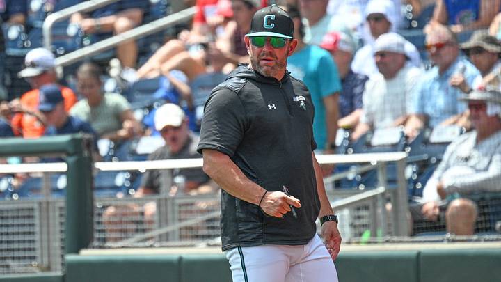 Jun 13, 2025; Omaha, Neb, USA; Coastal Carolina Chanticleers head coach Kevin Schnall looks to the field during the game against the Arizona Wildcats during the fifth inning at Charles Schwab Field. Mandatory Credit: Steven Branscombe-Imagn Images