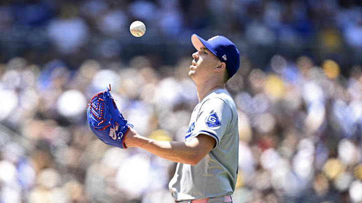 May 12, 2024; San Diego, California, USA; Los Angeles Dodgers starting pitcher Walker Buehler (21) tosses a ball in the air during the fourth inning against the San Diego Padres at Petco Park. Mandatory Credit: Orlando Ramirez-Imagn Images