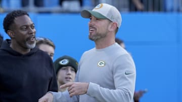 Dec 24, 2023; Charlotte, North Carolina, USA; Green Bay Packers head coach Matt LeFleur with fans during pregame warm ups against the Carolina Panthers at Bank of America Stadium. Mandatory Credit: Jim Dedmon-Imagn Images