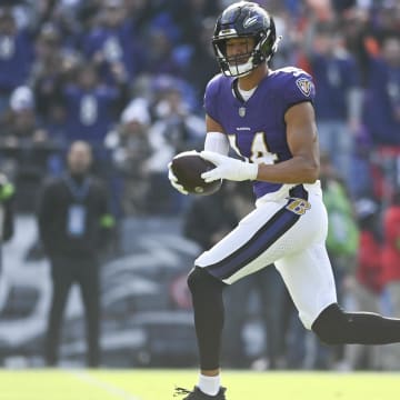 Nov 12, 2023; Baltimore, Maryland, USA; Baltimore Ravens safety Kyle Hamilton (14) returns a interception for a first quarter touchdown  against the Cleveland Browns  at M&T Bank Stadium. Mandatory Credit: Tommy Gilligan-USA TODAY Sports