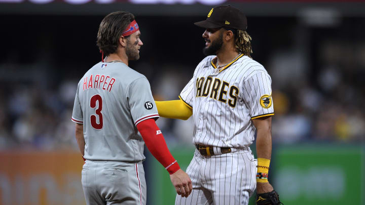 Philadelphia Phillies right fielder Bryce Harper (3) and San Diego Padres center fielder Fernando Tatis Jr. (right) talk during the middle of the sixth inning at Petco Park in 2021.