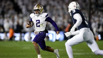 Nov 9, 2024; University Park, Pennsylvania, USA; Washington Huskies quarterback Demond Williams Jr (2) runs with the ball against the Penn State Nittany Lions during the third quarter at Beaver Stadium. Penn State won 35-6. Mandatory Credit: Matthew O'Haren-Imagn Images
