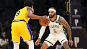 Mar 20, 2025; Los Angeles, California, USA; Milwaukee Bucks guard Gary Trent Jr. (5) defends against Los Angeles Lakers guard Bronny James (9) during the first half at Crypto.com Arena. Mandatory Credit: Jonathan Hui-Imagn Images