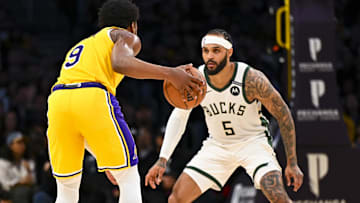Mar 20, 2025; Los Angeles, California, USA; Milwaukee Bucks guard Gary Trent Jr. (5) defends against Los Angeles Lakers guard Bronny James (9) during the first half at Crypto.com Arena. Mandatory Credit: Jonathan Hui-Imagn Images