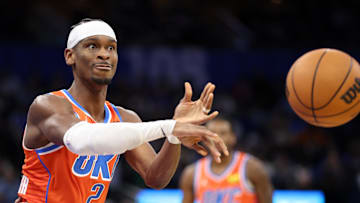 Dec 19, 2024; Orlando, Florida, USA; Oklahoma City Thunder guard Shai Gilgeous-Alexander (2) passes the ball against the Orlando Magic in the third quarter at Kia Center. Mandatory Credit: Nathan Ray Seebeck-Imagn Images