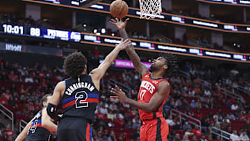Jan 1, 2024; Houston, Texas, USA; Houston Rockets forward Tari Eason (17) shoots the ball as Detroit Pistons guard Cade Cunningham (2) defends: Troy Taormina-Imagn Images