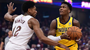 May 4, 2025; Cleveland, Ohio, USA; Indiana Pacers guard Bennedict Mathurin (00) drives to the basket against Cleveland Cavaliers forward De'Andre Hunter (12) during the first half in game one of the second round for the 2025 NBA Playoffs at Rocket Arena. Mandatory Credit: Ken Blaze-Imagn Images