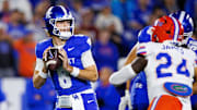 Nov 8, 2025; Lexington, Kentucky, USA; Kentucky Wildcats quarterback Cutter Boley (8) looks for a receiver during the first quarter against the Florida Gators at Kroger Field. Mandatory Credit: Jordan Prather-Imagn Images
