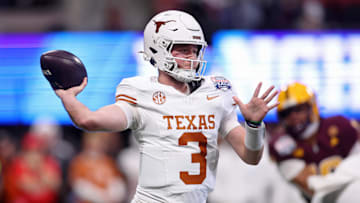 Jan 1, 2025; Atlanta, GA, USA; Texas Longhorns quarterback Quinn Ewers (3) passes the ball against the Arizona State Sun Devils during the first half of the Peach Bowl at Mercedes-Benz Stadium. Mandatory Credit: Brett Davis-Imagn Images
