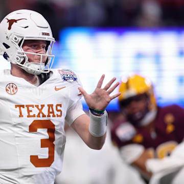 Jan 1, 2025; Atlanta, GA, USA; Texas Longhorns quarterback Quinn Ewers (3) passes the ball against the Arizona State Sun Devils during the first half of the Peach Bowl at Mercedes-Benz Stadium. Mandatory Credit: Brett Davis-Imagn Images