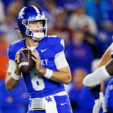 Nov 8, 2025; Lexington, Kentucky, USA; Kentucky Wildcats quarterback Cutter Boley (8) looks for a receiver during the first quarter against the Florida Gators at Kroger Field. Mandatory Credit: Jordan Prather-Imagn Images