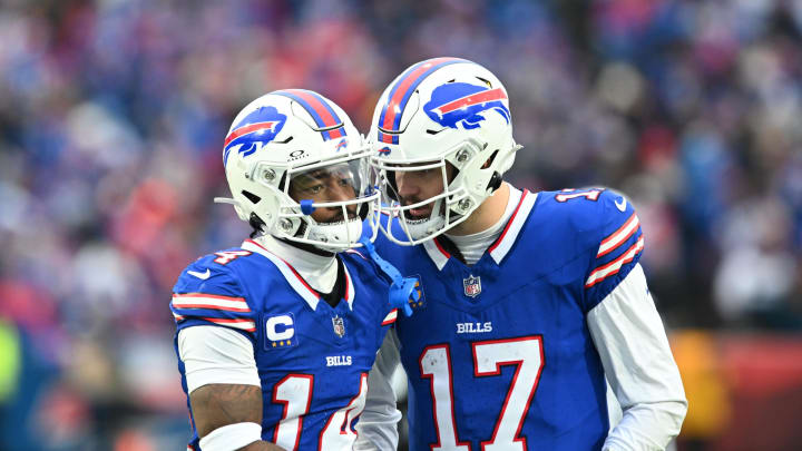 Dec 31, 2023; Orchard Park, New York, USA; Buffalo Bills quarterback Josh Allen (17) has a word with