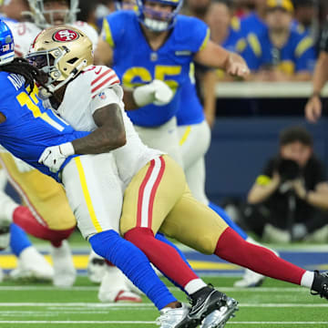 Oct 2, 2025; Inglewood, California, USA; Los Angeles Rams wide receiver Davante Adams (17) makes a catch against San Francisco 49ers  cornerback Renardo Green (0) during the first half at SoFi Stadium. Mandatory Credit: Kirby Lee-Imagn Images