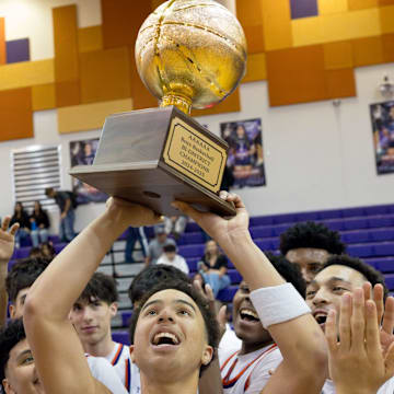 Eastlake boys basketball celebrate their 62-56 win against Odessa High in a playoff game on Tuesday, Feb. 18, 2025, at Eastlake High School in El Paso, Texas.