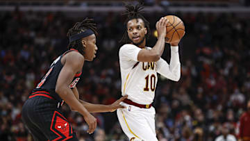 Jan 19, 2022; Chicago, Illinois, USA; Chicago Bulls guard Ayo Dosunmu (12) defends against Cleveland Cavaliers guard Darius Garland (10) during the second half at United Center. Mandatory Credit: Kamil Krzaczynski-Imagn Images