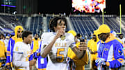 Miami Northwestern's Calvin Russell Jr. takes a selfie with his state medal after his team won the Class 3A championship against Raines on Dec. 14, 2024.