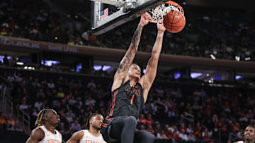 Dec 10, 2024; New York, New York, USA;  Miami  Hurricanes center Lynn Kidd (1) dunks in the second half against the Tennessee Volunteers at Madison Square Garden. Mandatory Credit: Wendell Cruz-Imagn Images