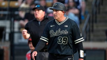 Purdue coach Greg Goff walks back after talking to an umpire