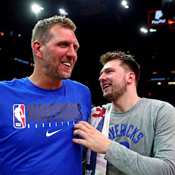 May 15, 2022; Phoenix, Arizona, USA; Dallas Mavericks guard Luka Doncic (77) greets former player Dirk Nowitzki after beating the Phoenix Suns in game seven of the second round for the 2022 NBA playoffs at Footprint Center. Mandatory Credit: Mark J. Rebilas-Imagn Images