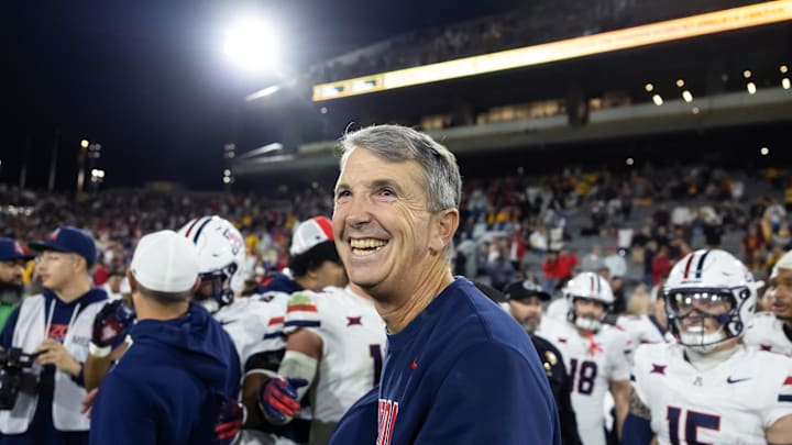Nov 28, 2025; Tempe, Arizona, USA; Arizona Wildcats head coach Brent Brennan celebrates against the Arizona State Sun Devils during the 99th Territorial Cup at Mountain America Stadium. Mandatory Credit: Mark J. Rebilas-Imagn Images
