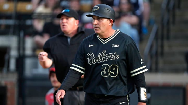 Purdue coach Greg Goff walks back after talking to an umpire