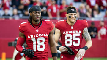 Jan 5, 2025; Glendale, Arizona, USA; Arizona Cardinals wide receiver Marvin Harrison Jr. (18) and tight end Trey McBride (85) against the San Francisco 49ers at State Farm Stadium. Mandatory Credit: Mark J. Rebilas-Imagn Images