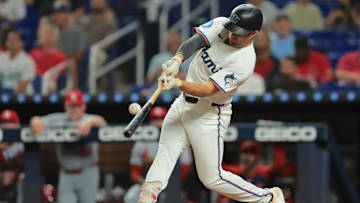 Aug 18, 2025; Miami, Florida, USA; Miami Marlins left fielder Jakob Marsee (87) hits an RBI double against the St. Louis Cardinals during the sixth inning at loanDepot Park. Mandatory Credit: Sam Navarro-Imagn Images