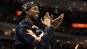 Mar 2, 2022; Milwaukee, Wisconsin, USA;  Former Milwaukee Bucks player Brandon Jennings cheers during the fourth quarter against the Miami Heat at Fiserv Forum. Mandatory Credit: Jeff Hanisch-Imagn Images