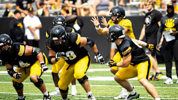 Aug 9, 2025; Iowa quarterback Mark Gronowski (11) catches a snap during the Hawkeyes Kids Day NCAA football open practice at Kinnick Stadium in Iowa City, Iowa. Mandatory Credit: Joseph Cress for the Des Moines Register