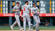 Jun 23, 2024; Denver, Colorado, USA; Washington Nationals center fielder Jacob Young (30) and right fielder Lane Thomas (28) celebrate with second baseman Luis Garcia Jr. (2) after the game against the Colorado Rockies at Coors Field.