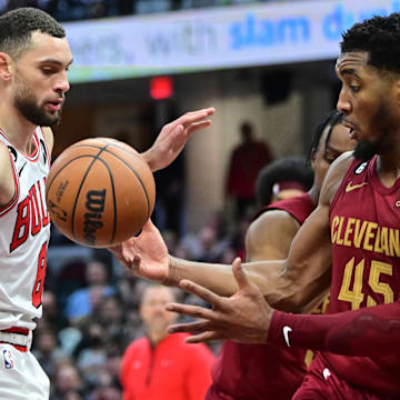 Jan 2, 2023; Cleveland, Ohio, USA; Cleveland Cavaliers guard Donovan Mitchell (45) and Chicago Bulls guard Zach LaVine (8) go for a rebound during the second half at Rocket Mortgage FieldHouse. Mandatory Credit: Ken Blaze-Imagn Images