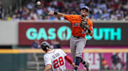Sep 14, 2025; Cumberland, Georgia, USA; Houston Astros second baseman Mauricio Dubon (14) tries to complete a double play over Atlanta Braves first baseman Matt Olson (28) during the third inning at Truist Park. 