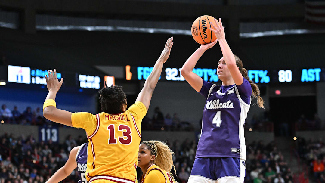 Mar 29, 2025; Spokane, WA, USA; Kansas State Wildcats guard Serena Sundell (4) shoots against USC Trojans center Rayah Marshall (13) during the first half of a Sweet 16 NCAA Tournament basketball game at Spokane Arena. Mandatory Credit: James Snook-Imagn Images