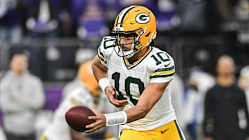 Dec 29, 2024; Minneapolis, Minnesota, USA; Green Bay Packers quarterback Jordan Love (10) looks to hand the ball off against the Minnesota Vikings during the first quarter at U.S. Bank Stadium. Mandatory Credit: Jeffrey Becker-Imagn Images