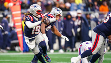 New England Patriots quarterback Joe Milton III  looks to pass the ball against the Buffalo Bills 