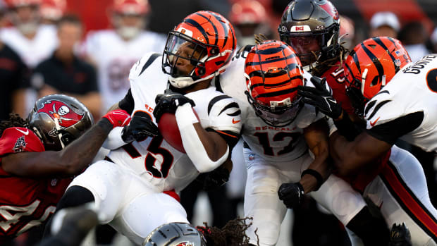 Cincinnati Bengals halfback Chris Evans (25) is tackled by Tampa Bay Buccaneers cornerback Tavierre Thomas (37) 